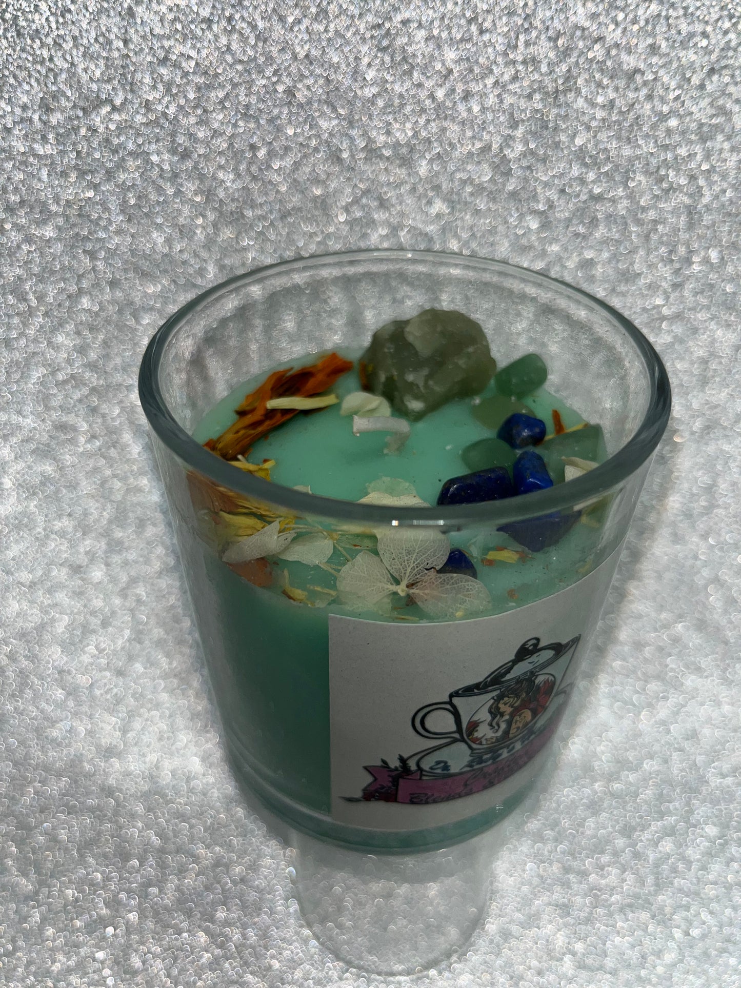 Handmade scented candles with gems.